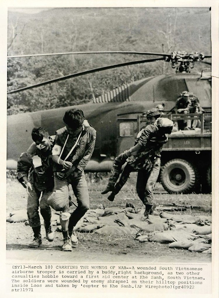 1971--wounded-south-vietnamese-airborne-trooper-is-carried-by-buddy-in-background-as-two-other...jpg