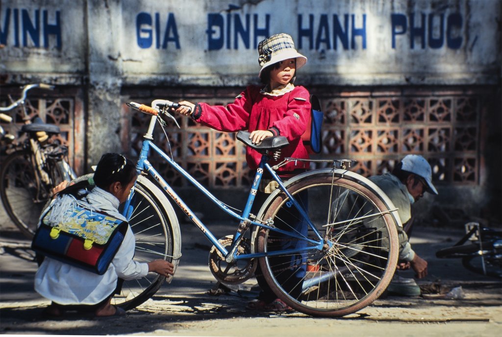 Schoolgirls-repairing-their-bicycle.jpg