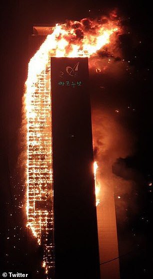 34155384_8820051_the_fire_which_is_believed_to_have_started_on_the_12th_floor_of__a_2_16021764...jpg