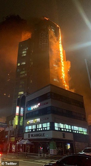 34155388_8820051_the_fire_which_is_believed_to_have_started_on_the_12th_floor_of__a_1_16021764...jpg