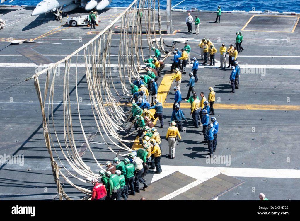 220917-n-uf592-1137-pacific-ocean-sept-17-2022-sailors-raise-a-barricade-during-a-flight-deck-...jpg