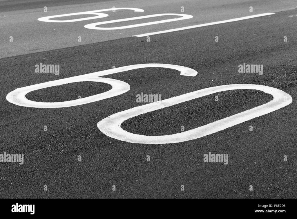 60-km-pro-stunde-tempolimit-fahrbahnmarkierung-auf-dunkelgrau-asphalt-p8e2d8.jpg
